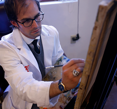 Matthew Horowitz works on a painting